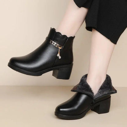Black leather ankle boots with faux fur lining and a studded strap, low chunky heel (pair)