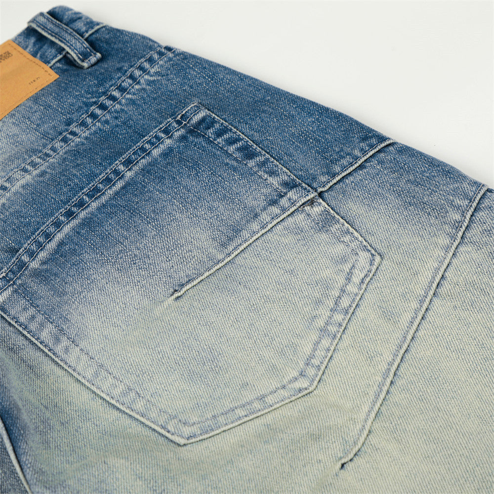 Jeans en jean délavé et poli à empiècements de couleur