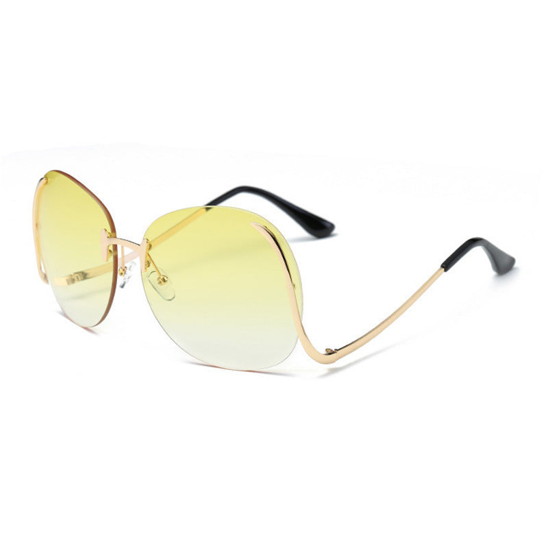 Lunettes de soleil sans monture à branches incurvées et décoratives