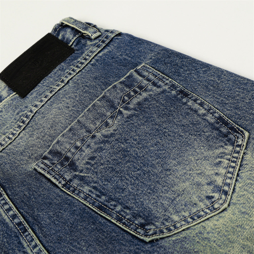 Pantalon jean délavé jambes larges droites avec blocs de couleur