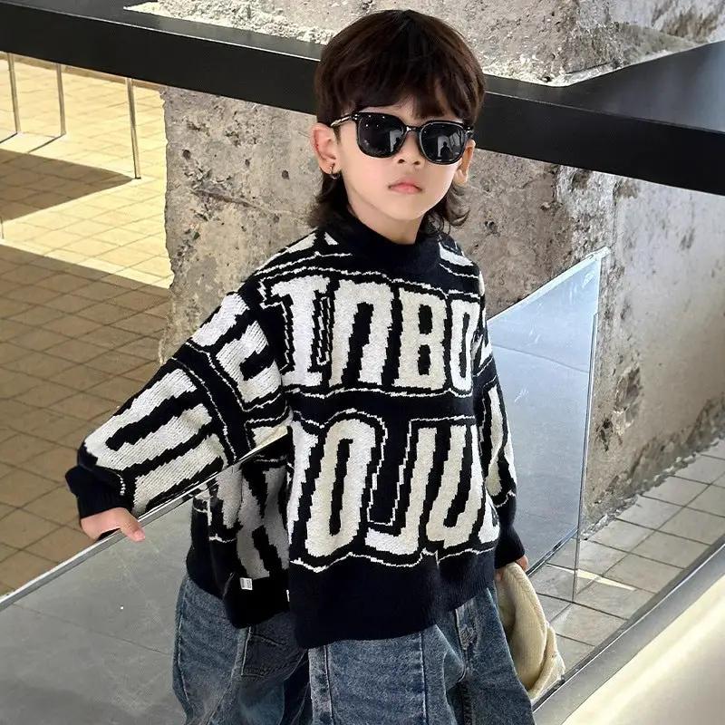Boys warm thickened knit sweater pullover with long sleeves in black and white with a bold graphic pattern