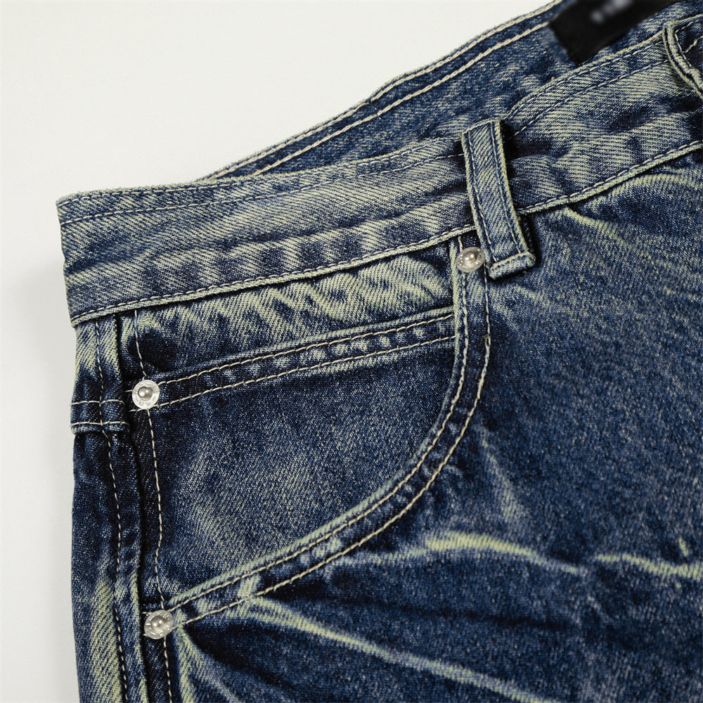 Pantalon jean délavé jambes larges droites avec blocs de couleur