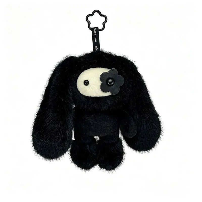 Cute Juju Rabbit plush keychain in black fur with cream face patch and flower accent