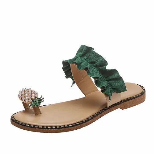 Pineapple Pearl Beach Slides with green ruffled strap, beige footbed, pineapple pearl toe ornament.