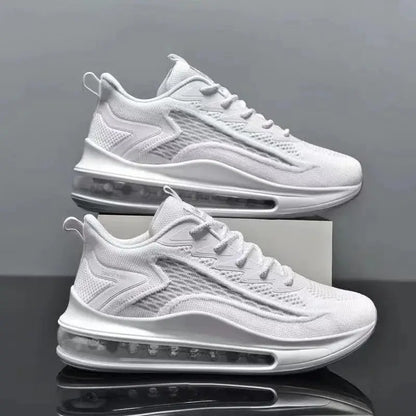 Pair of men's white running sneakers with breathable mesh upper and visible air-cushioned sole.