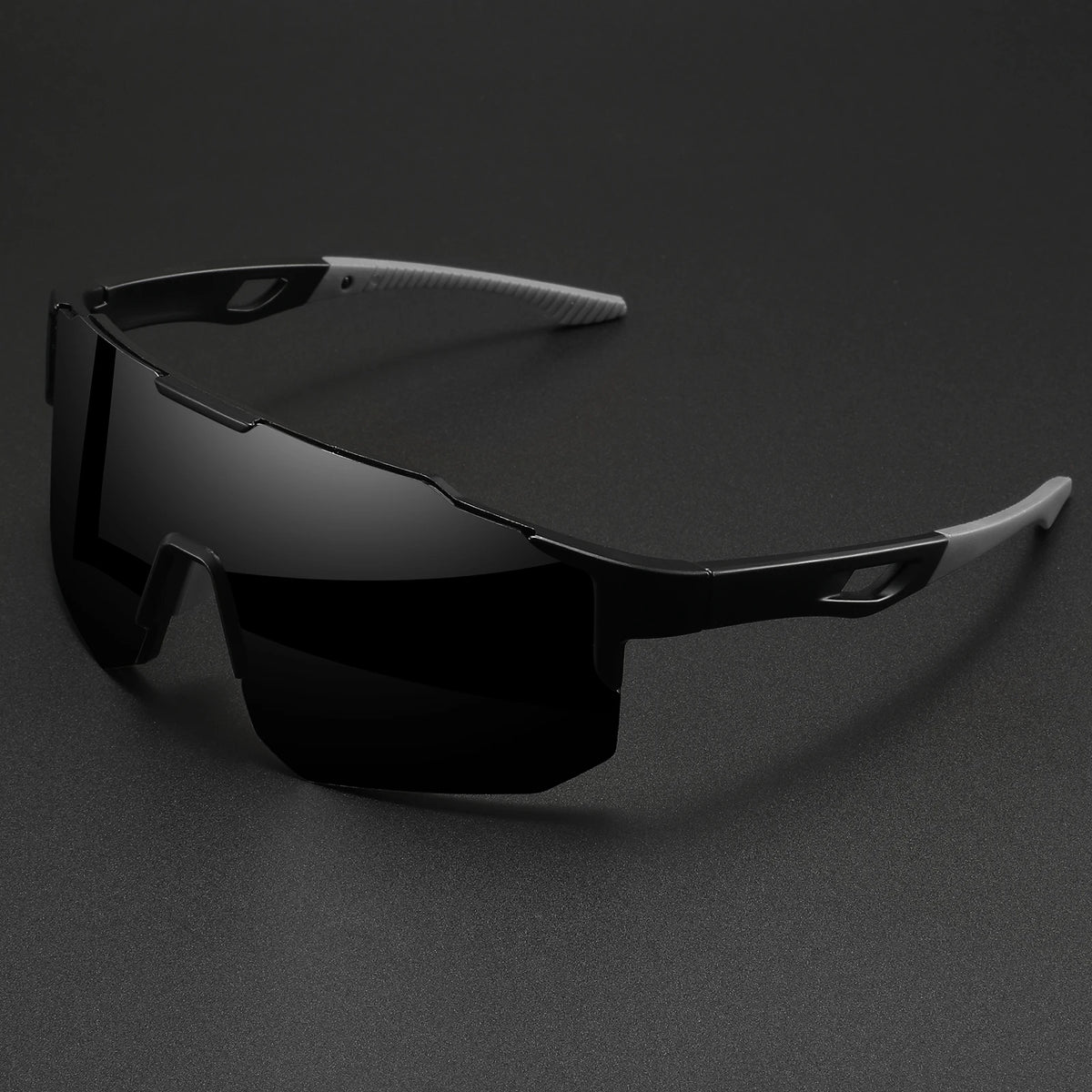 Oversized black sports sunglasses with dark lenses and grey temples