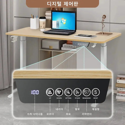Electric height adjustable standing desk with wood-toned top and gray metal legs; control panel with up/down and sit/stand buttons.