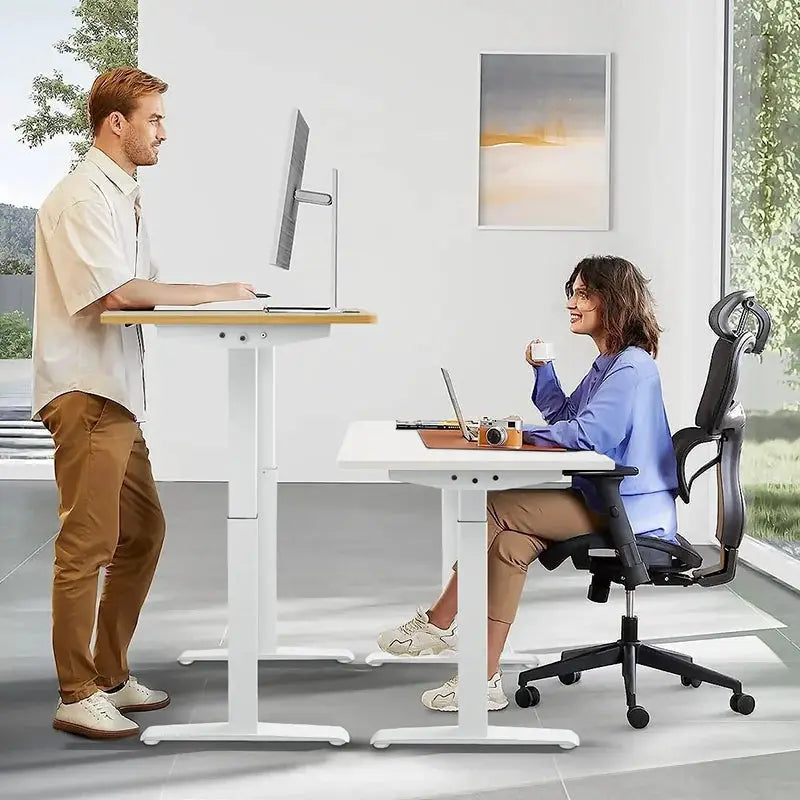 Electric height-adjustable standing desk with wooden top and white frame; two sit-stand desks shown.