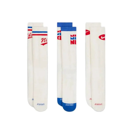 Nike Everyday Crew socks 3-pack; white Dri-FIT athletic crew socks with red and blue Nike branding.