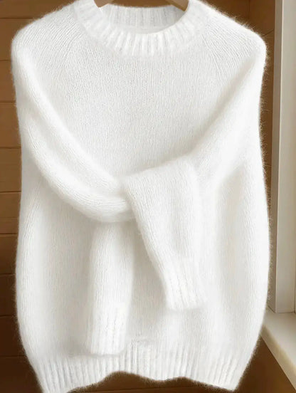 Womens soft cozy knit sweater in white fluffy yarn with ribbed crew neck and long sleeves.