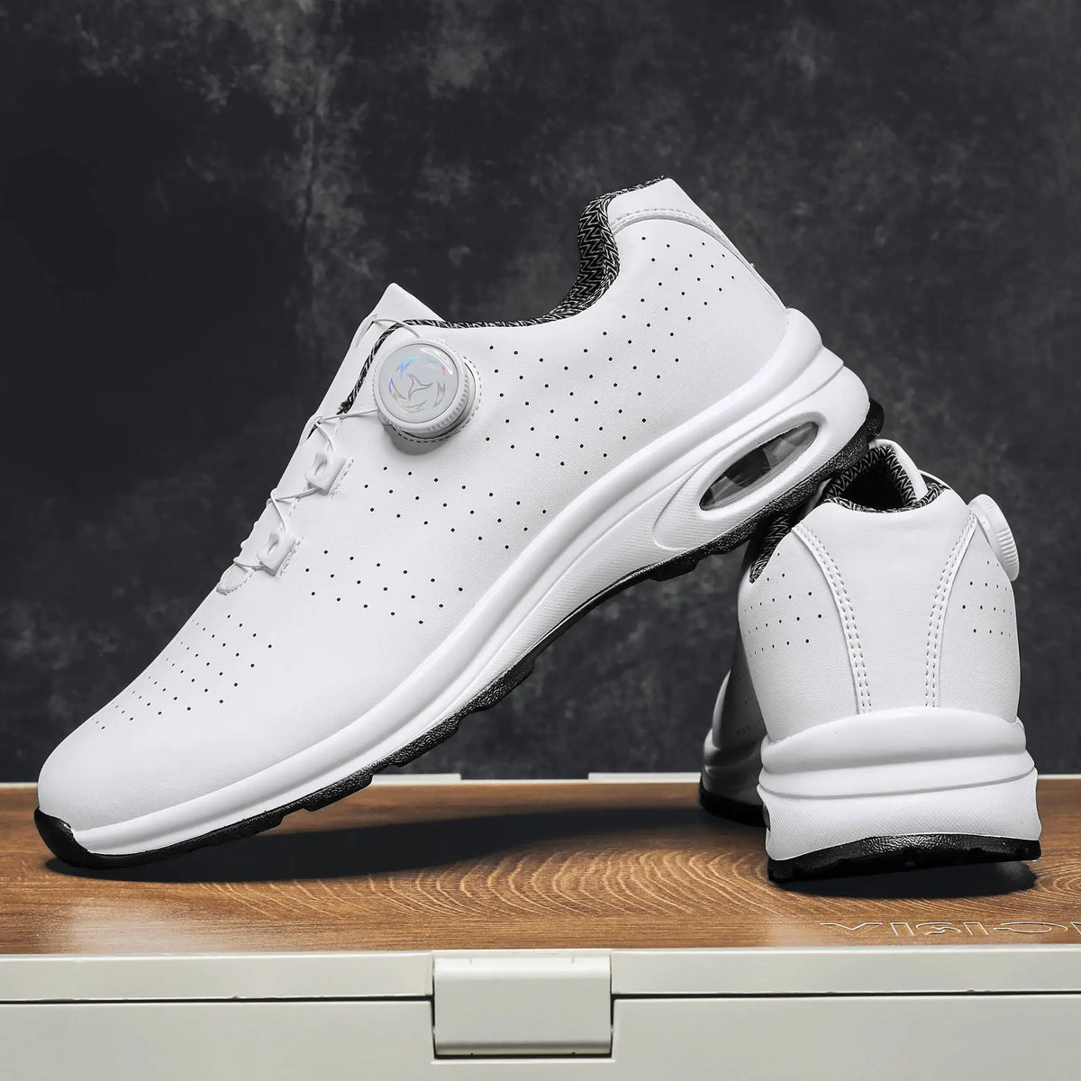 Casual white sneaker with perforated upper, dial closure, and air-cushioned sole