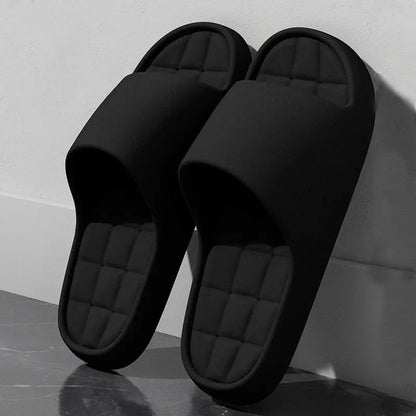 Unisex black slide sandals with quilted footbeds, lightweight and non-slip.