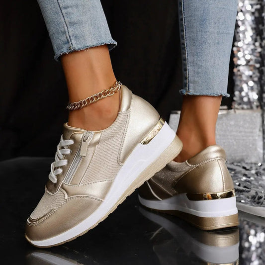 Women's lace-up casual sneakers with side zipper, metallic gold finish and thick white sole