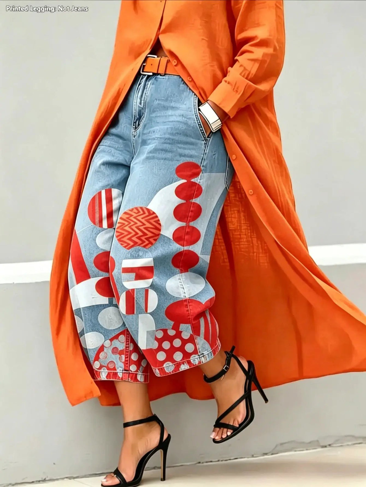 Green wide-leg mid-rise Capri pants with bold red circular patchwork on light denim