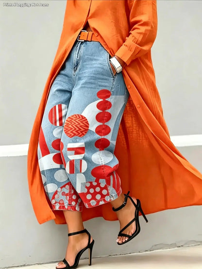 Green wide-leg mid-rise Capri pants with bold red circular patchwork on light denim