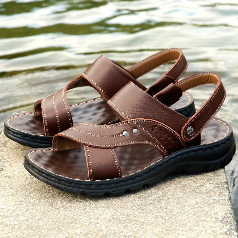 Pair of men's brown leather sandals with adjustable back strap by AdTec