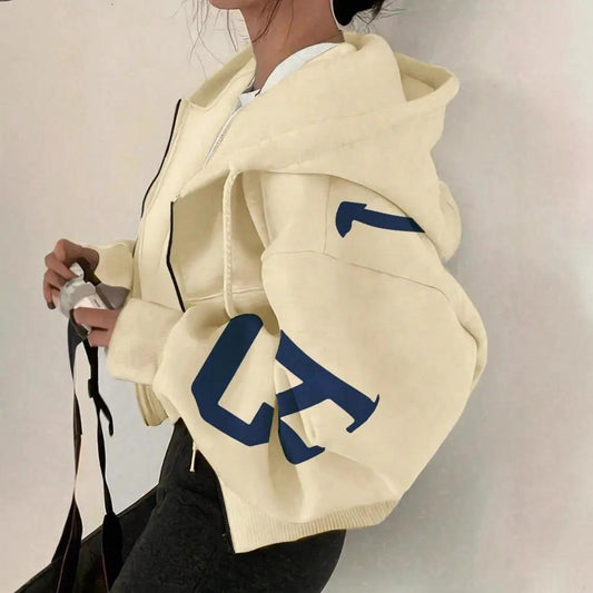 Soft Full Zip Long Sleeve Sweatshirt in cream with blue graphic on the sleeve and hood.