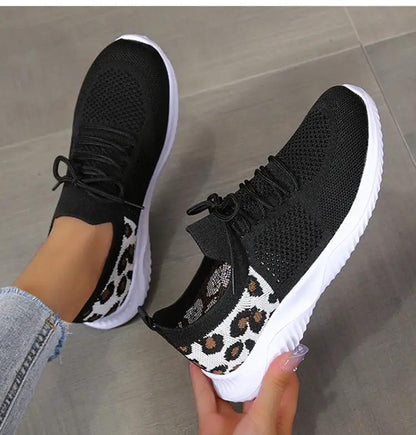 Women’s leopard-print lace-up sneakers with black knit upper and white sole