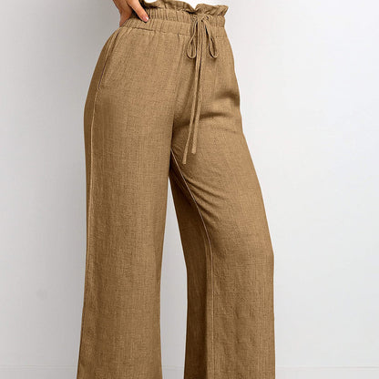 Pantalon large à taille élastique, lacets et coupe courte de couleur unie