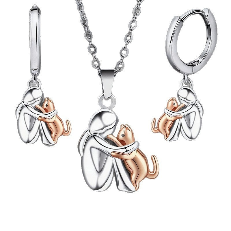 Ensemble de boucles d'oreilles Fillette et Chien s'enlaçant
