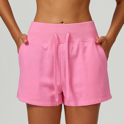 Short de sport molletonné taille haute avec cordon de serrage et poches pour l'extérieur