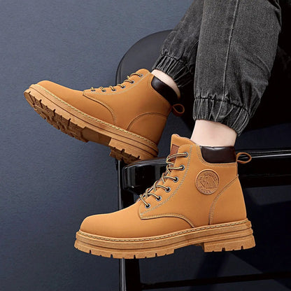 Atlas Mens Waterproof Winter Boots by AdTec, pair of tan leather boots with rugged lug soles.
