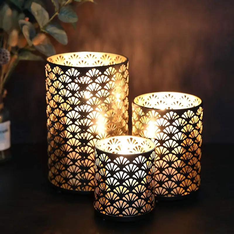 Metal hurricane lanterns set of 3 by JHY DESIGN with intricate fan-cut patterns for decorative candlelight