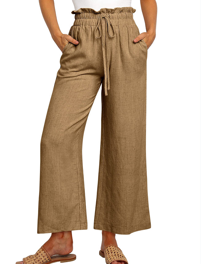 Pantalon large à taille élastique, lacets et coupe courte de couleur unie