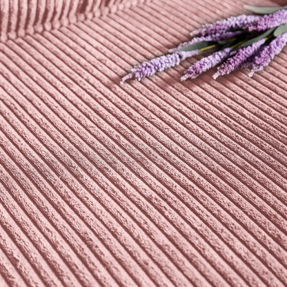 Corduroy sofa upholstery in pink with ribbed texture