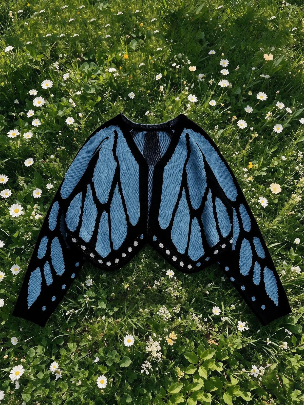 Women's butterfly knit cardigan in blue and black, open-front long-sleeve knitted outerwear.