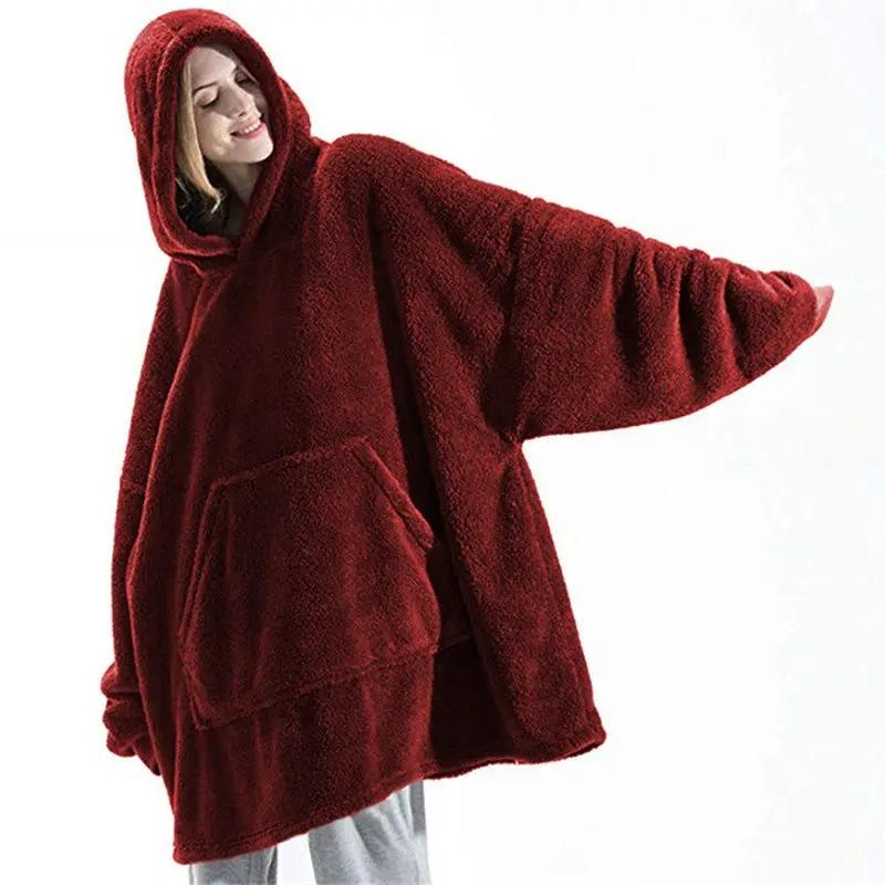 Hoodie sweatshirt in red fleece with a large front pocket and hood, wearable blanket style.
