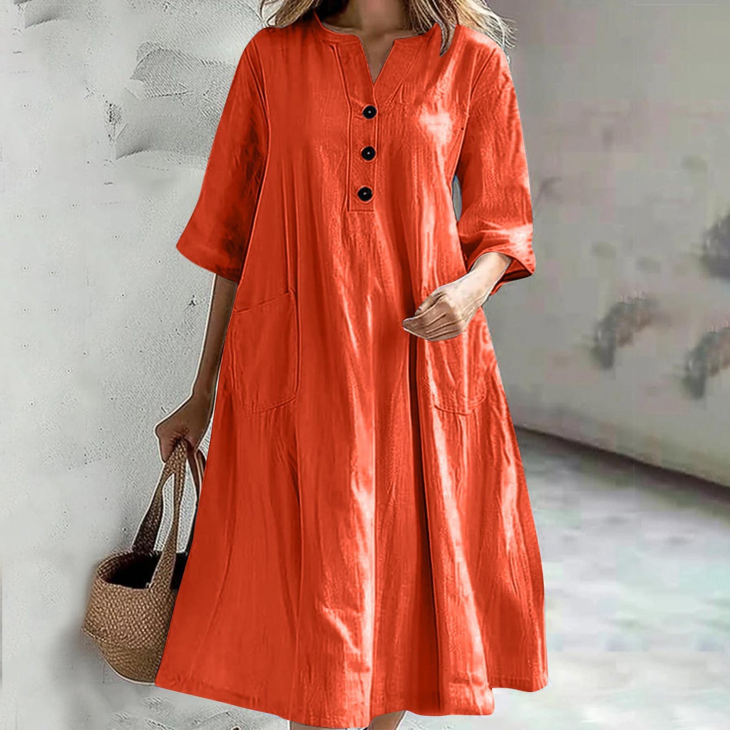 Combinaison ample à trois boutons et poches pour femme