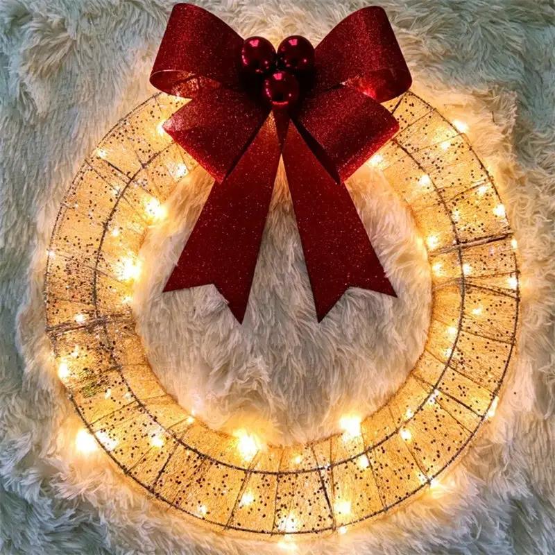 Christmas luminous LED wreath, 50cm golden metal ring with warm white lights and a large red bow