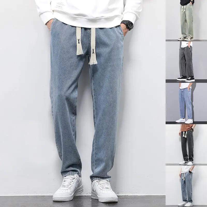 Men's loose wide-leg denim jeans with drawstring waist and elasticated waistband in blue; color variants shown (6 total)
