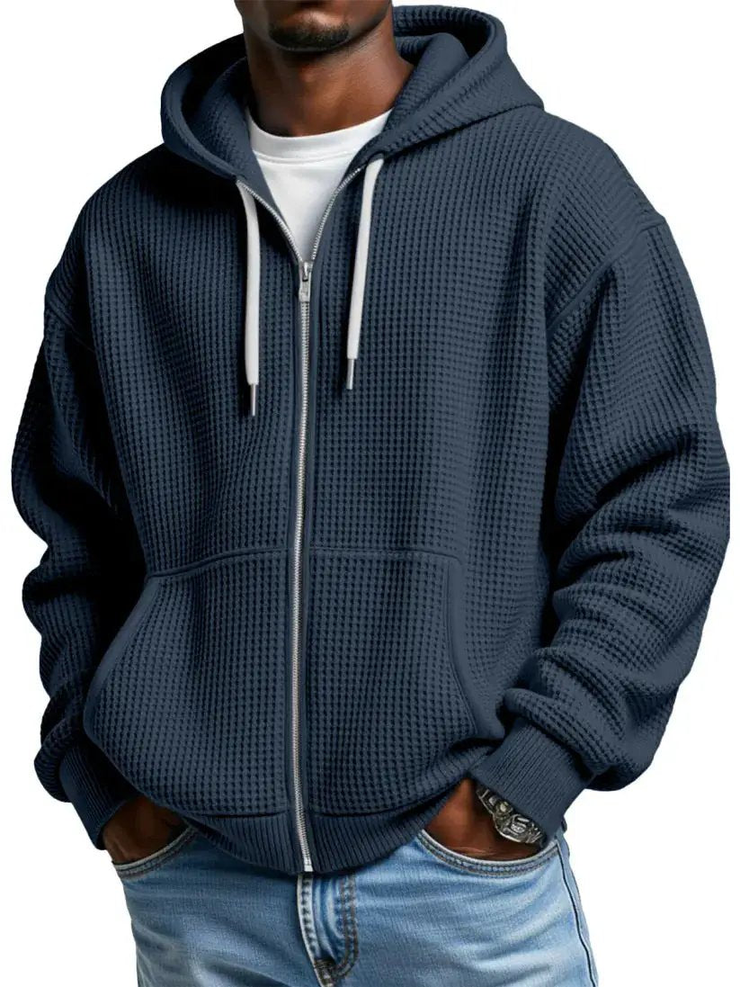 Men's navy zip-up hoodie with waffle-knit fabric, kangaroo pockets and ribbed cuffs