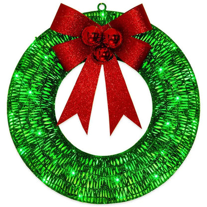 Christmas wreath with green LED lights and red glitter bow for front door decor.