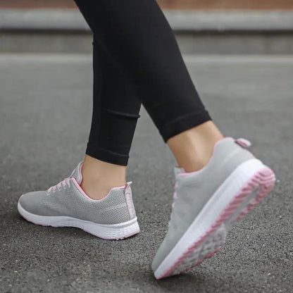 Women Shoes Sports Sneakers pair, gray mesh with pink trim.