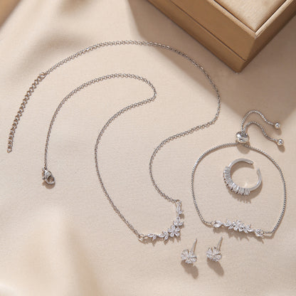 Ensemble de bijoux élégant et simple incrusté de zircon, collier fleur argent, boucles d'oreilles exquises, bracelet et bague, adapté aux femmes pour un usage quotidien ou en vacances