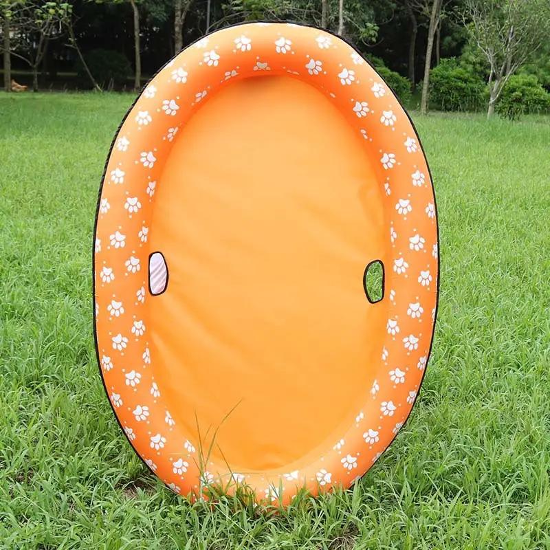 Dog swimming pool inflatable hammock float in orange with white paw-print border