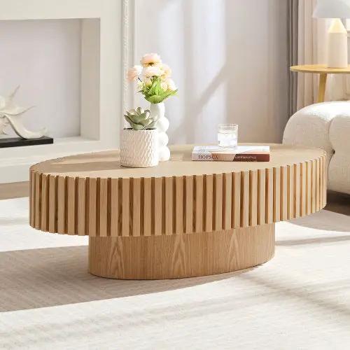 Modern handmade drum coffee table in natural wood with vertical slat sides.