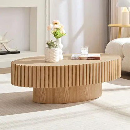 Modern handmade drum coffee table in natural wood with vertical slat sides.