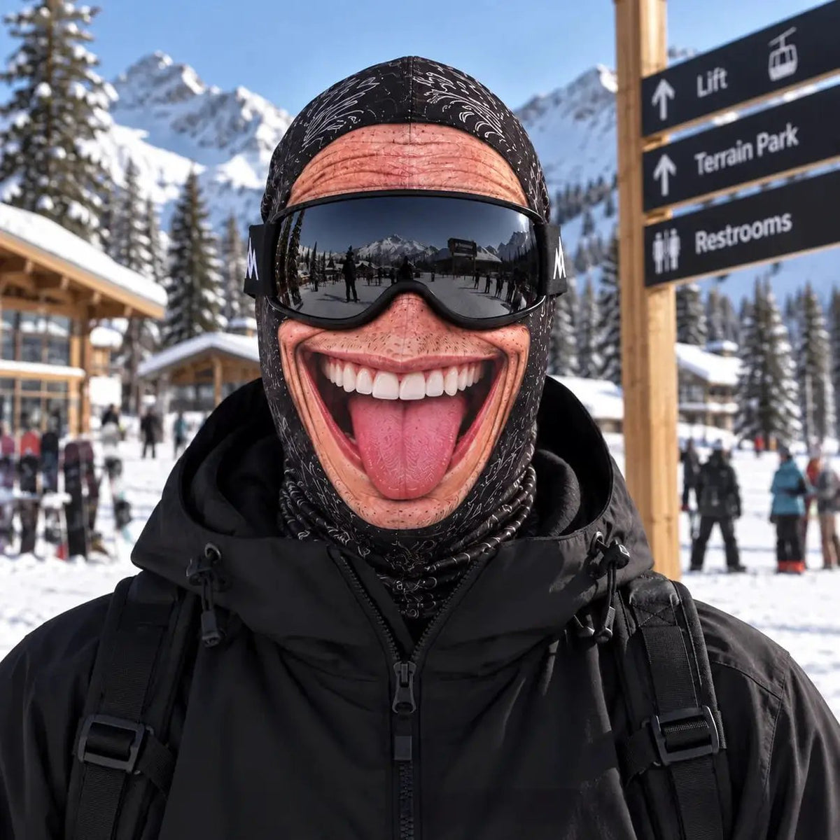 Winter ski balaclava by AdTec: black windproof thermal mask with realistic mouth graphic, worn with goggles