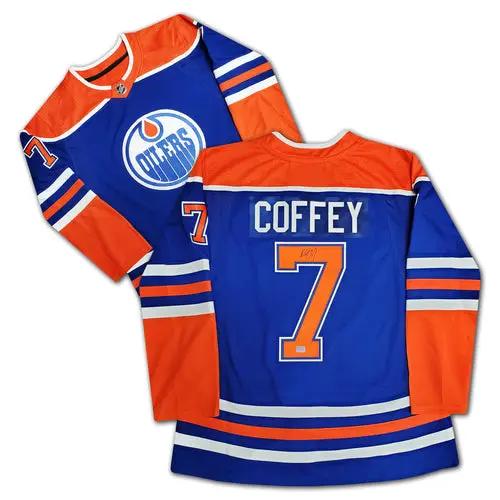 2 autographed blue Edmonton Oilers jerseys with orange trim, back shows number 7