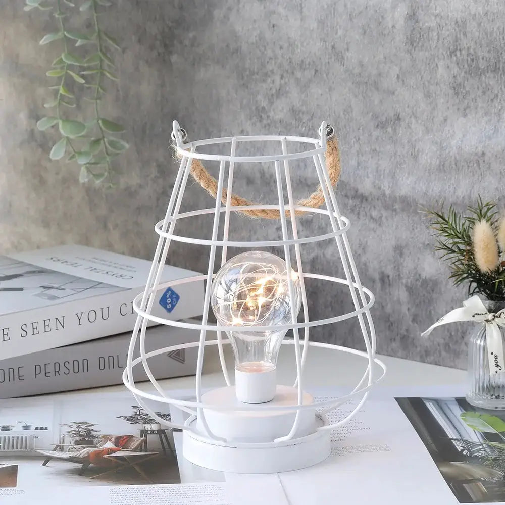 Cordless accent lamp by JHY DESIGN, 8.5 inches tall, white wire cage with Edison-style bulb.