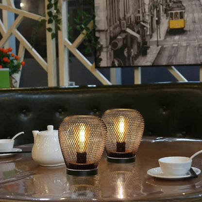 6.7-inch tall battery-powered outdoor table lamps, set of 2, by JHY Design, bronze mesh lanterns with warm glow.