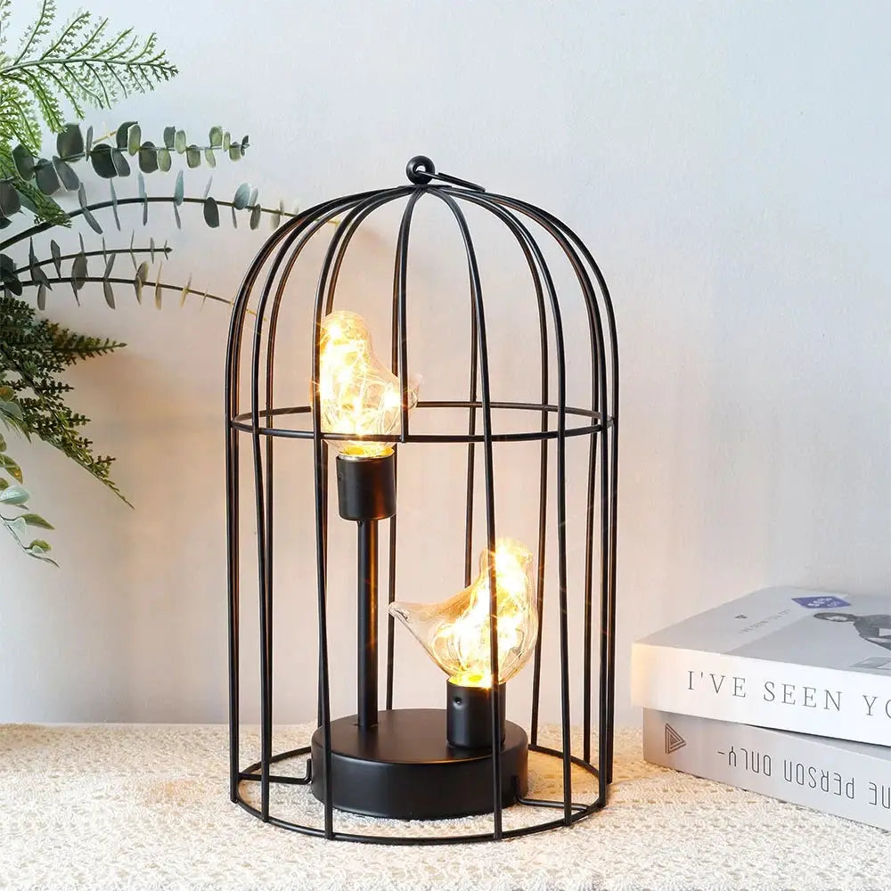 12-inch tall battery-operated birdcage lamp with two illuminated birds in a black metal cage by JHY DESIGN
