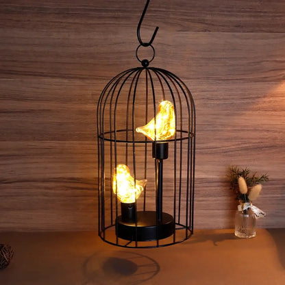 12-inch battery-operated birdcage decorative lamp with two amber bird-shaped bulbs in a black metal cage, JHY DESIGN